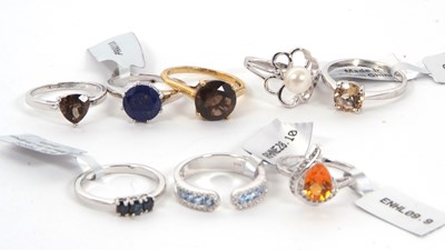 Lot 353 - Eight gemset rings: to include smokey quartz,...