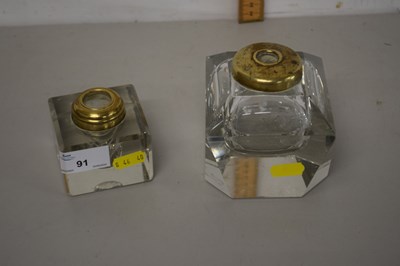 Lot 91 - Two clear glass inkwells