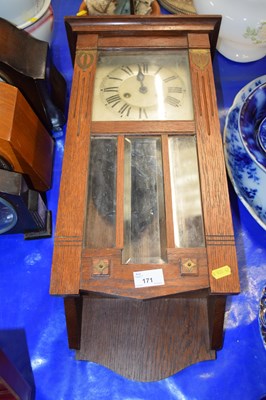 Lot 171 - An early 20th Century oak cased mantel clock