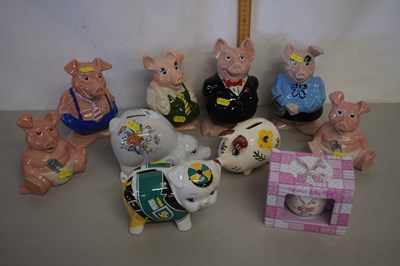 Lot 203 - A set of Wade Nat West piggy banks plus...