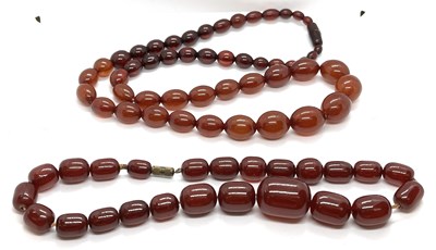 Lot 188 - Two 'cherry amber' bead necklaces, one with...