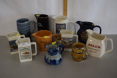 Lot 211 - A collection of various modern pub jugs