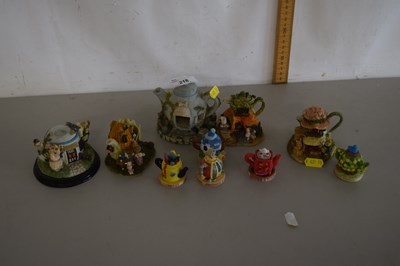 Lot 218 - Collection of various small resin teapot figures