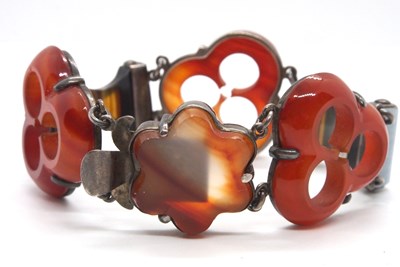 Lot 127 - A late 19th century carved agate bracelet, the...