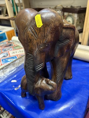 Lot 539 - A hardwood model of mother and baby elephant