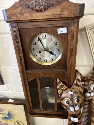 Lot 285 - An oak cased wall clock