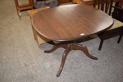 Lot 195 - An Ercol pedestal dining table