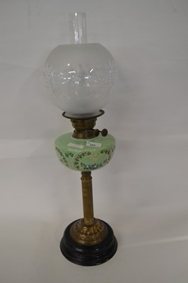 Lot 284 - A further oil lamp with porcelain reservoir...