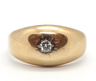 Lot 26 - A 9ct diamond ring, the gypsy set round...