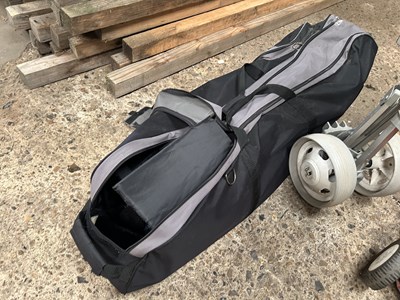 Lot 1046 - A golf bag with clubs together with a travel...