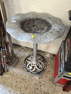 Lot 1061 - A metal bird bath