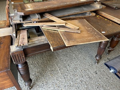 Lot 334 - A Victorian oak extending dining table on...