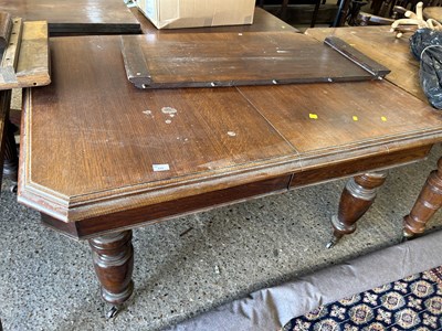 Lot 335 - A late Victorian oak extending dining table...