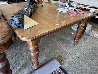 Lot 337 - Late Victorian oak dining table on turned legs