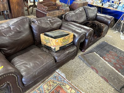 Lot 342 - A pair of brown leather sofas