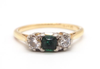 Lot 15 - An emerald and diamond ring, the central...