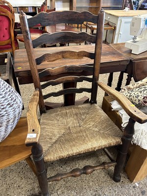 Lot 350 - A ladder back and rush seated carver chair