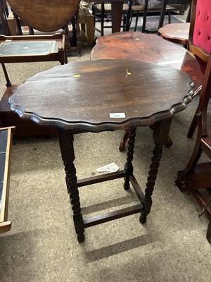 Lot 380 - An oak occasional table on barley twist legs