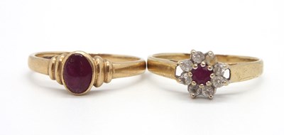 Lot 19 - Two 9ct ruby rings: the first set with a small...