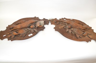 Lot 358 - A pair of Black Forest carved wall plaques...