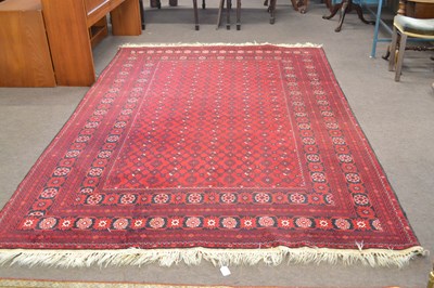 Lot 382 - A 20th Century Middle Eastern wool floor rug...