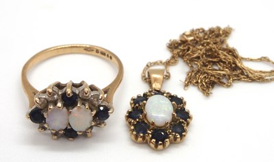 Lot 122 - A 9ct opal and sapphire ring and similar...