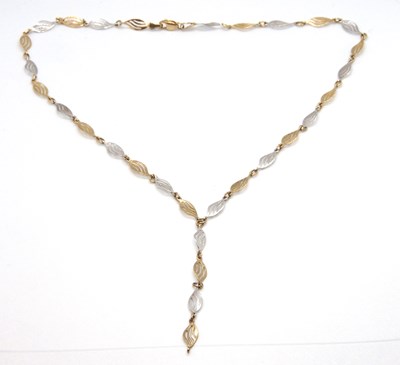 Lot 105 - A 9ct bi-colour necklace, with alternating...