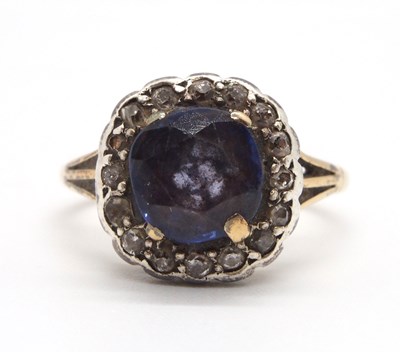 Lot 78 - A sapphire and diamond ring, the cushion cut...