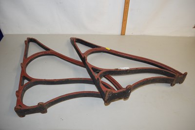 Lot 19 - A pair of cast iron wall brackets or bench frame