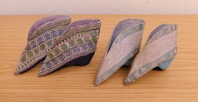 Lot 12 - Two pairs of Chinese lotus shoes, the fabric...