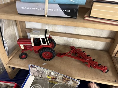 Lot 502 - Model International tractor and plough