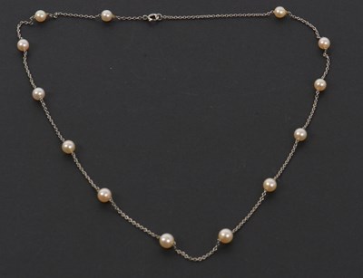 Lot 161 - A cultured pearl necklace, set with 5mm...