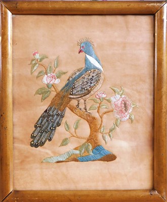 Lot 190 - A silkwork picture of a peacock, stitched on...