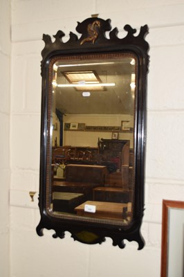 Lot 184 - An ebonised framed wall mirror in the Georgian...