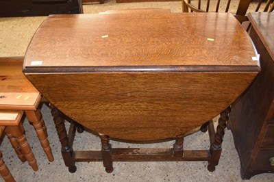 Lot 201 - Early 20th Century oak drop leaf dining table...