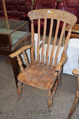 Lot 251 - A Victorian elm seated Windsor chair