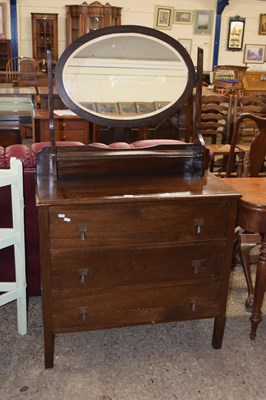 Lot 272 - An early 20th Century oak mirror back dressing...