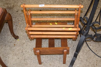 Lot 284 - Magazine rack and a small stool