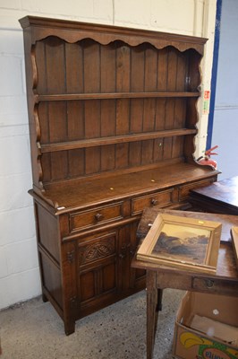 Lot 292 - 20th Century oak dresser with carved...