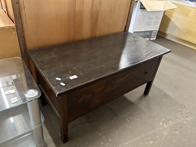 Lot 695 - A dark wood coffee table