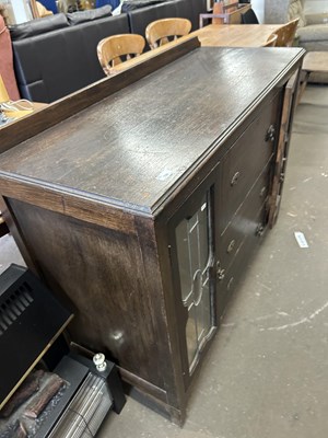 Lot 709 - An early 20th Century oak sideboard with lead...