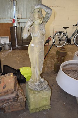 Lot 1041 - Composite garden statue on plinth