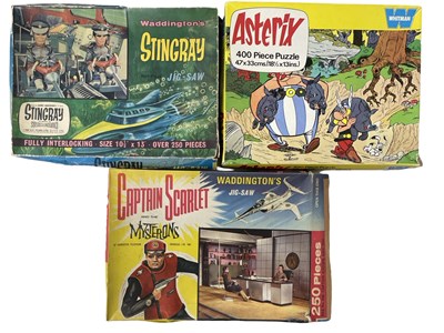 Lot 250 - A collection of vintage jigsaw puzzles in...