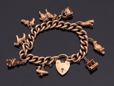 Lot 468 - A 9ct charm bracelet, the curblink bracelet...