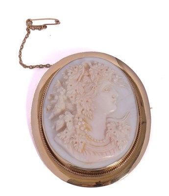 Lot 311 - A 9ct shell cameo brooch, the oval carved...