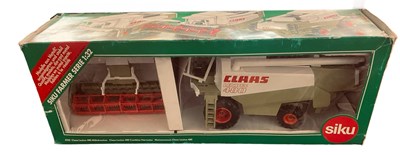 Lot 121 - A boxed SIKU 1:32 scale model Claas Lexicon...