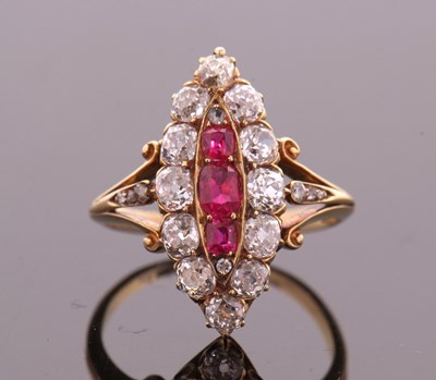 Lot 400 - A ruby and diamond ring, the marquise shape...