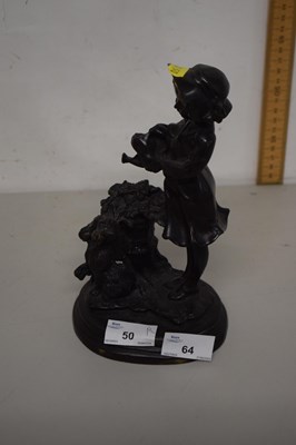 Lot 64 - A small hollow bronze figure of a girl with...