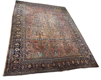 Lot 588 - Large Iranian carpet, with central panel of...