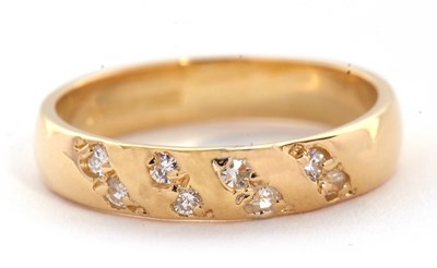 Lot 64 - An 18ct diamond ring, set with four diagonal...